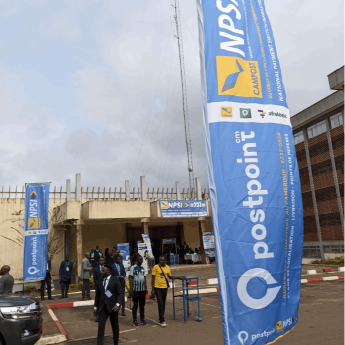 Postpoint and CAMPOST NPSI launch banners outside the event venue in Yaoundé